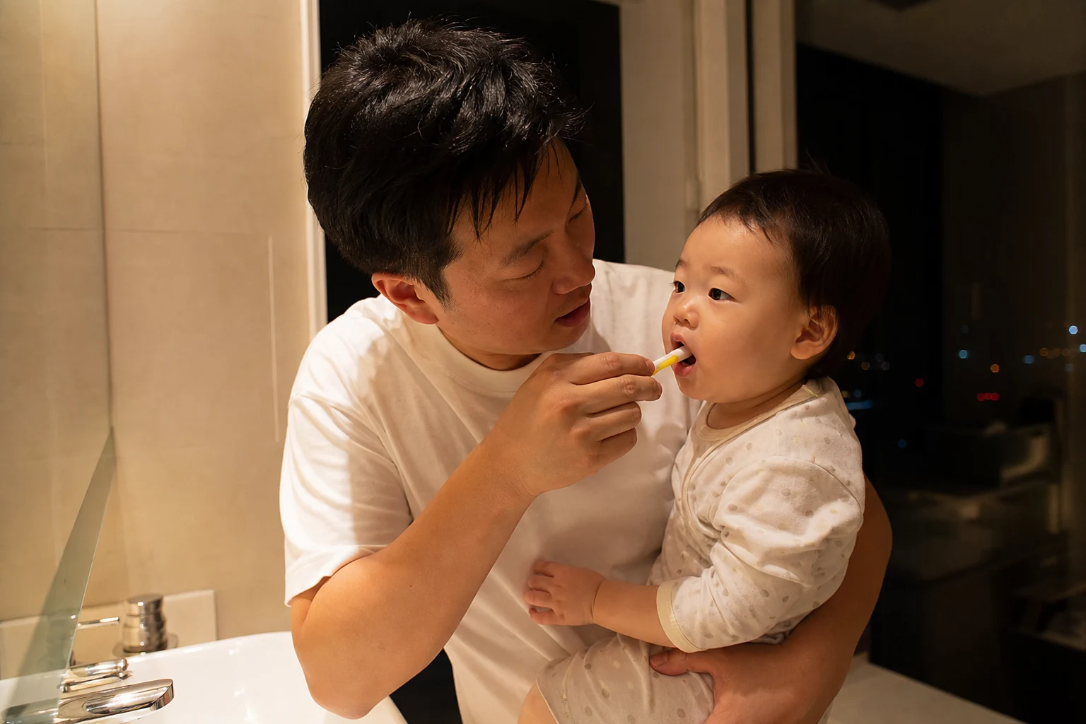 A photorealistic real-life scene with a baby and caregiver or clinician demonstrating safe teething and first-tooth care